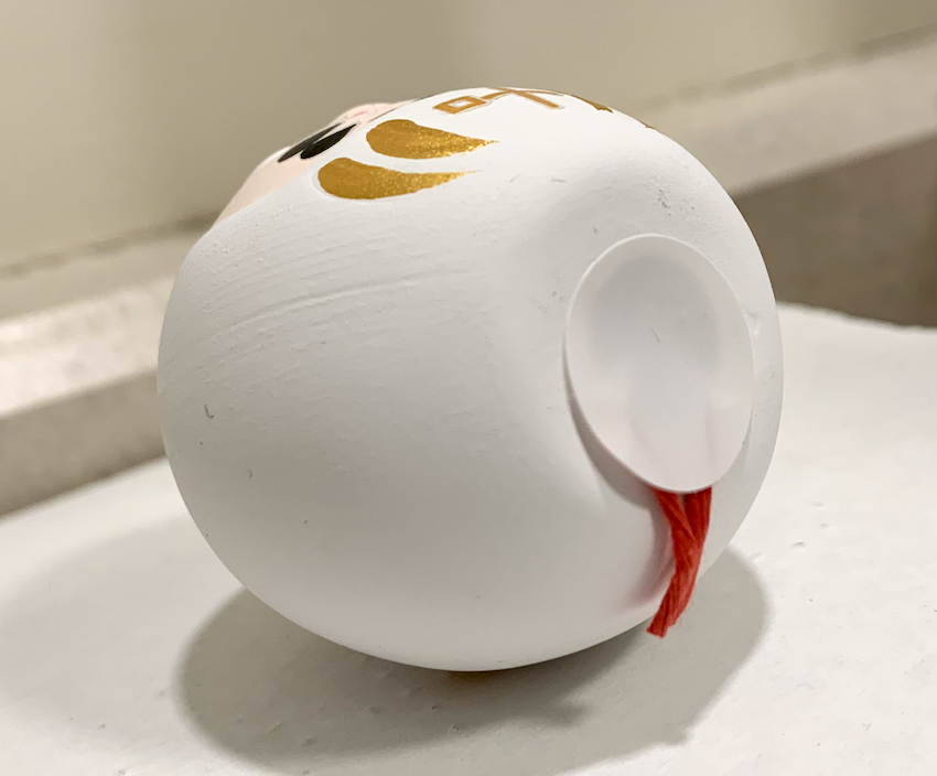 Daruma doll with omikuji